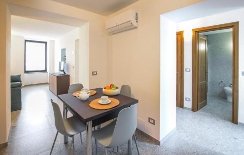 a dining room with a dining table and chairs at Beautiful Apartment In Castel Focognano in Castel Focognano