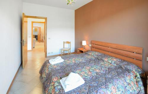 Katil atau katil-katil dalam bilik di Cozy Apartment In Tuoro Sul Trasimeno