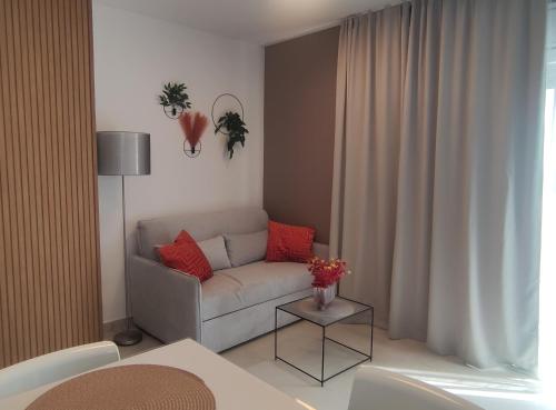 a living room with a couch and a table at Vivien in Podstrana