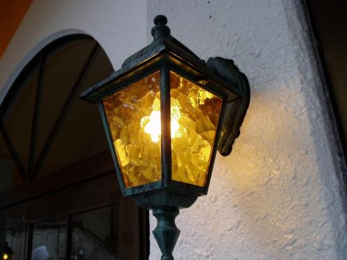 a street light on the side of a building at Lodge Matsuya in Nozawa Onsen