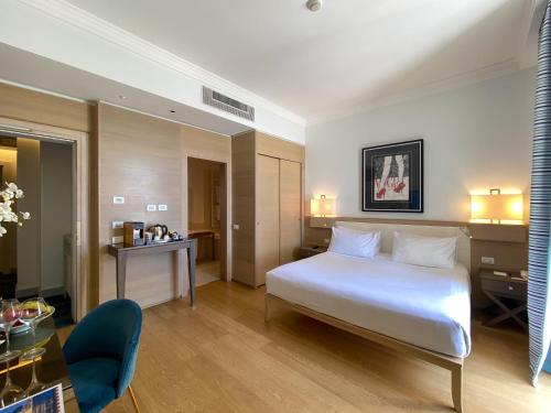 Ένα ή περισσότερα κρεβάτια σε δωμάτιο στο Grand Hotel Alassio Beach & Spa Resort - The Leading Hotels of the World