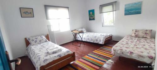 Un pat sau paturi într-o cameră la Stuffstock Hostel