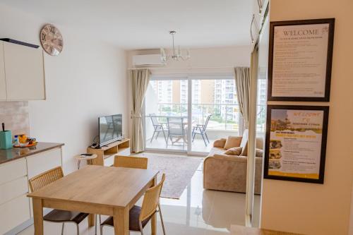 a kitchen and living room with a table and a dining room at Andreanius Caesar Resort & Spa Studio with Niche, Stunning Balcony View in Iskele