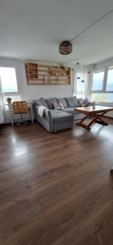 a living room with a couch and a table at Rincón de Cerler in Cerler