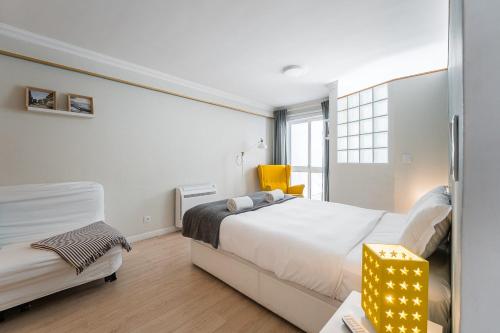 Ένα ή περισσότερα κρεβάτια σε δωμάτιο στο GuestReady - Porto by Pilar Ridge