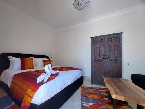 Una cama o camas en una habitación de Riad Babette