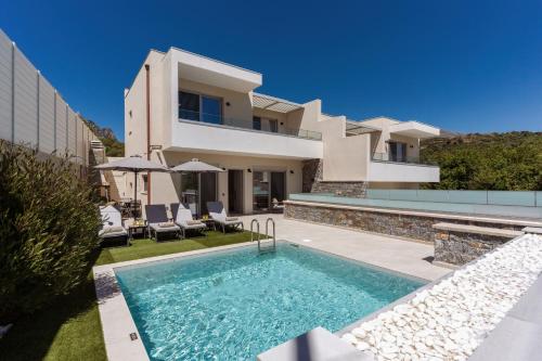 an image of a villa with a swimming pool at Nemesis Villas in Plakias