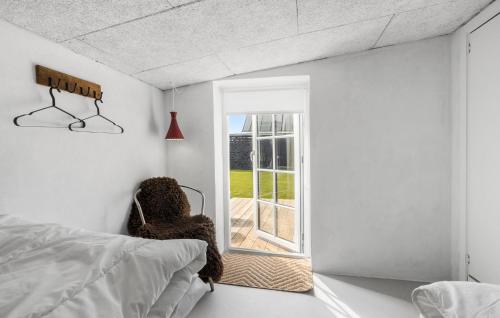 a bedroom with a bed and a window at Lovely Home In Thisted With Wifi in Thisted