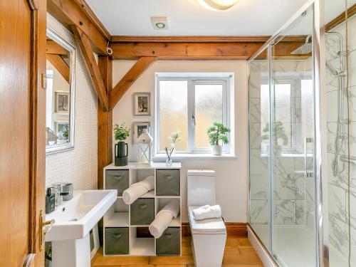 a bathroom with a sink and a shower at The Lodge in Gloucester