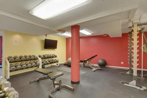 a gym with rows of chairs and a red wall at Edgewater #303 in Destin