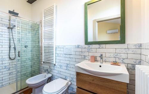 a bathroom with a sink and a toilet and a mirror at Casa Livio in Ponte Buggianese