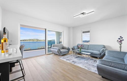 a living room with a view of the water at Cozy Apartment In Vodice With Wifi in Vodice