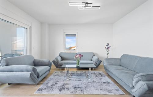 a living room with two couches and a table at Cozy Apartment In Vodice With Wifi in Vodice