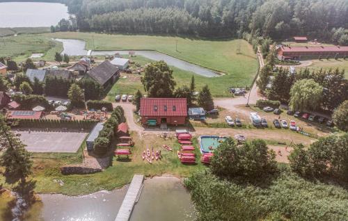 an aerial view of a resort with a pool and a house at Beautiful Apartment In Tumiany in Tumiany