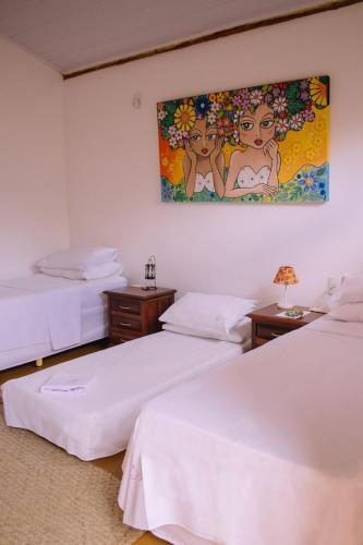 Ένα ή περισσότερα κρεβάτια σε δωμάτιο στο Quinta dos Samaniego - Chalés Rústicos e Suítes
