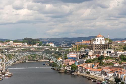 a view of a city with a bridge over a river at GuestReady - Porto Fantastic View in Vila Nova de Gaia