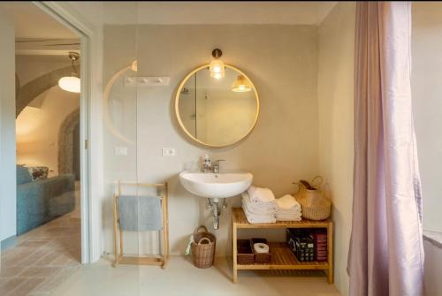 a bathroom with a sink and a mirror at Le Fonti di San Gimignano in San Gimignano