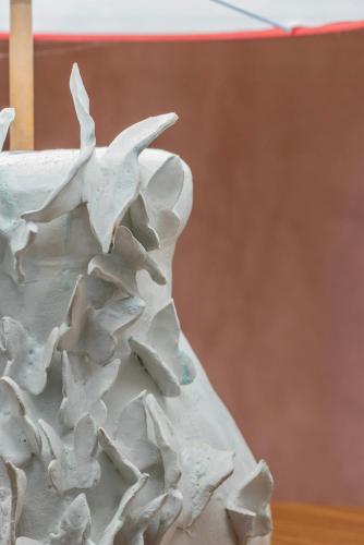 a close up of a white vase with white flowers at Le Fonti di San Gimignano in San Gimignano