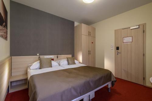 Postel nebo postele na pokoji v ubytování Peras Wellness Hotel