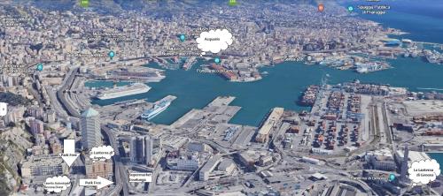 une vue aérienne sur une ville avec des bâtiments et une rivière dans l'établissement LA LANTERNA DI ANGELO, à Gênes