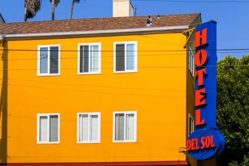 an orange building with a sign in front of it at Hotel Del Sol in San Francisco