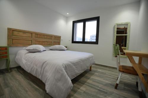 Ένα ή περισσότερα κρεβάτια σε δωμάτιο στο Le vert Serein