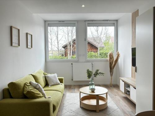 Area tempat duduk di Appartement cosy au coeur du Haut-Jura