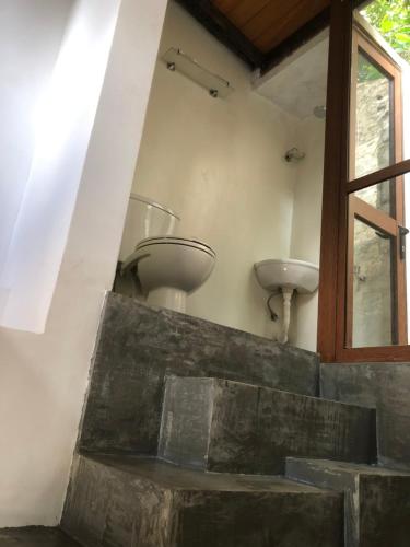 a bathroom with a sink and a sink at RedBrick House Rumassala in Galle