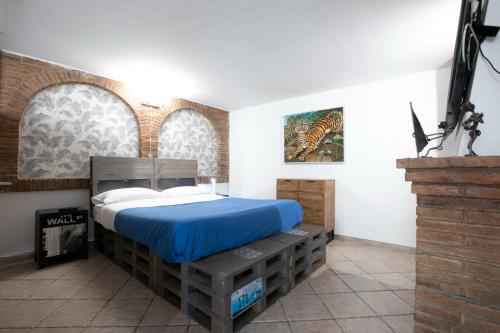 a bedroom with a bed in a room with two windows at TonyHouse in Casal Palocco