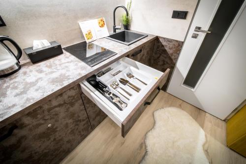 a kitchen with a sink and a counter top at Internesto Brno Krenova in Brno