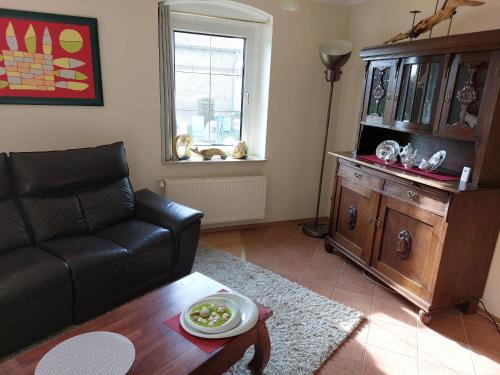 a living room with a couch and a table at Fewo Frieda in Seehausen