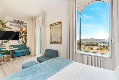 a bedroom with a bed and a large window at LUXURY DREAMS in La Spezia