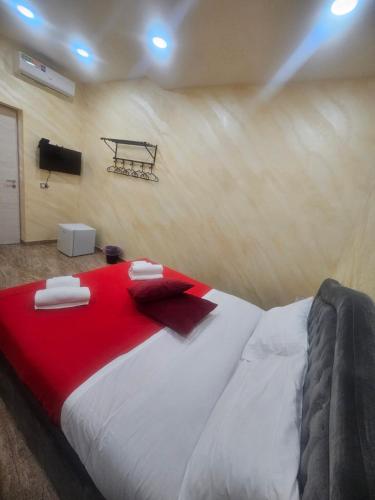 a bedroom with a large bed with a basketball hoop on the wall at Golden house sicily in Catania