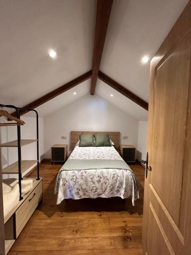 a bedroom with a bed and bunk beds at A Barreira in Ferrol