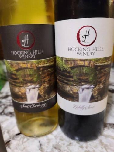 two bottles of wine sitting next to each other at Hocking Hills Cabin-Private Hot Tub, Hiking, Caves in Rockbridge