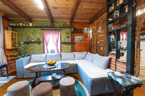 a living room with a couch and a table at Salerno camp in Plav