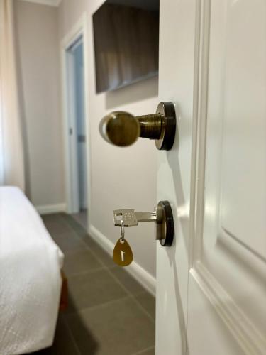 a door with a key in a room at Camere di Bianca in Foligno