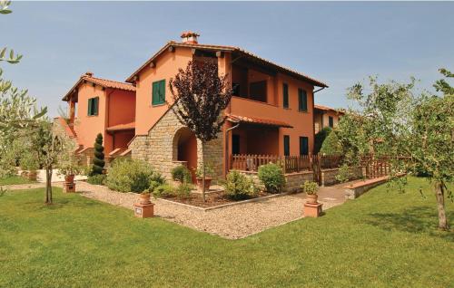 a large house with a garden in front of it at Casa Macinarino APPARTAMENTO 13 con piscina in Loro Ciuffenna