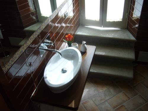 a bathroom with a sink and a window at BeB I Giardinetti in Caprarola