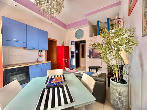 a kitchen with a table and a dining room at CIAOBRO Apartment in Modugno