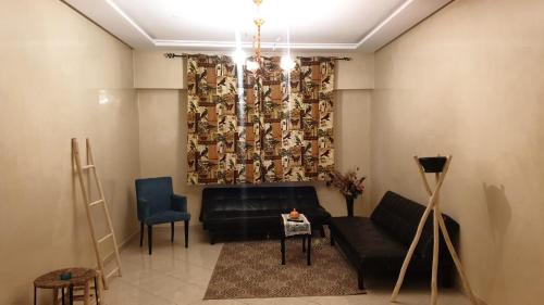 Een zitgedeelte bij Appartement Mohammed V Airport Top
