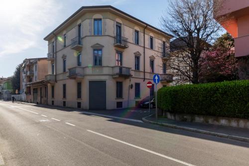 a large building on the side of a street at Residenza '900 in Castellanza