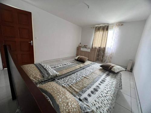 Una cama o camas en una habitación de Apt ressource et vue panoramique