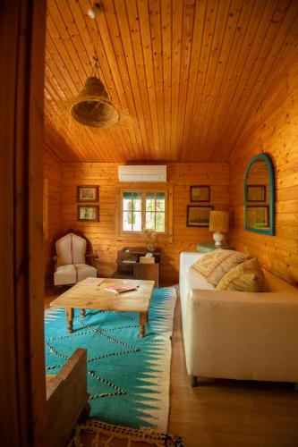 a bedroom with a bed and a table in a room at El botanico de Sagra in Sagra