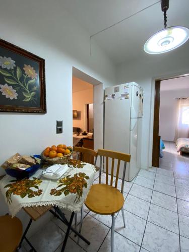 a kitchen and dining room with a table and chairs at Aggelina in Sárkhos
