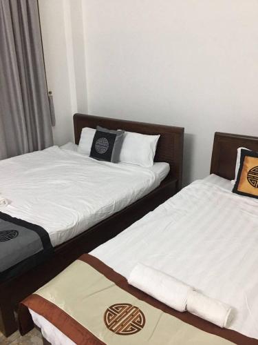 Giường trong phòng chung tại Gray Stone Homestay