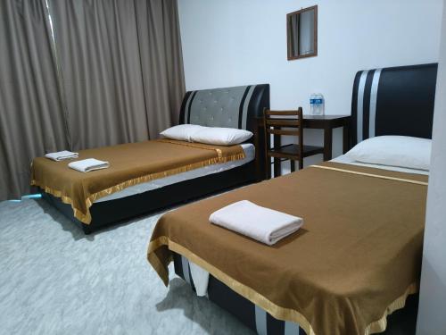 Ένα ή περισσότερα κρεβάτια σε δωμάτιο στο NaVita Lodge