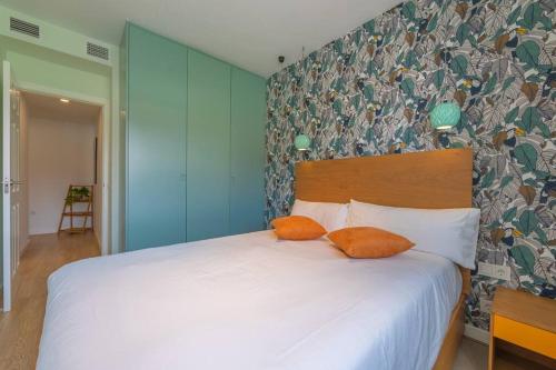 En eller flere senge i et værelse på AMAZONIA - Apartamento moderno centrico con Piscina Terraza y Parking