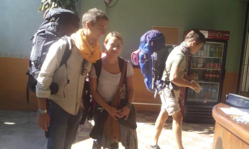 a group of people standing in a room with backpacks at Hierba De Conejo Hostel in Oaxaca City