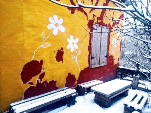 a painting of a building with snow on it at old house in Konjic